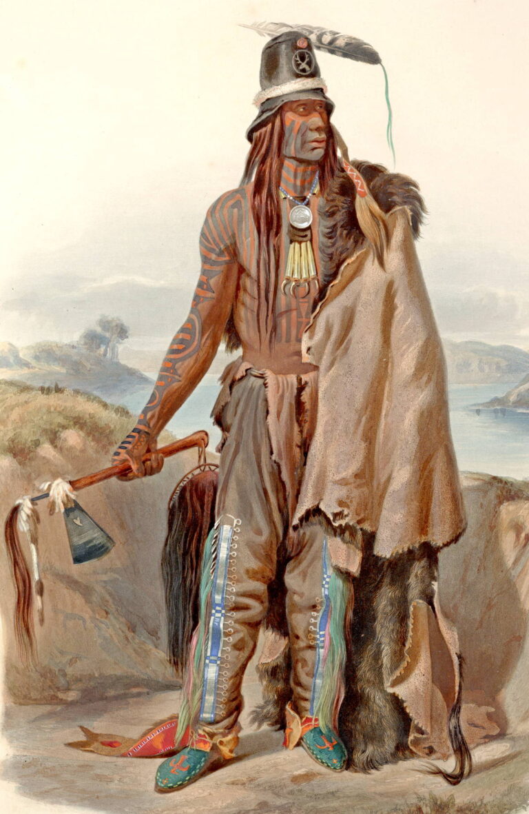 Addih Hiddish - válečník kmene Hidatsů. Na nohou má legíny, dvě samostatné nohavice přivázané k opasku.