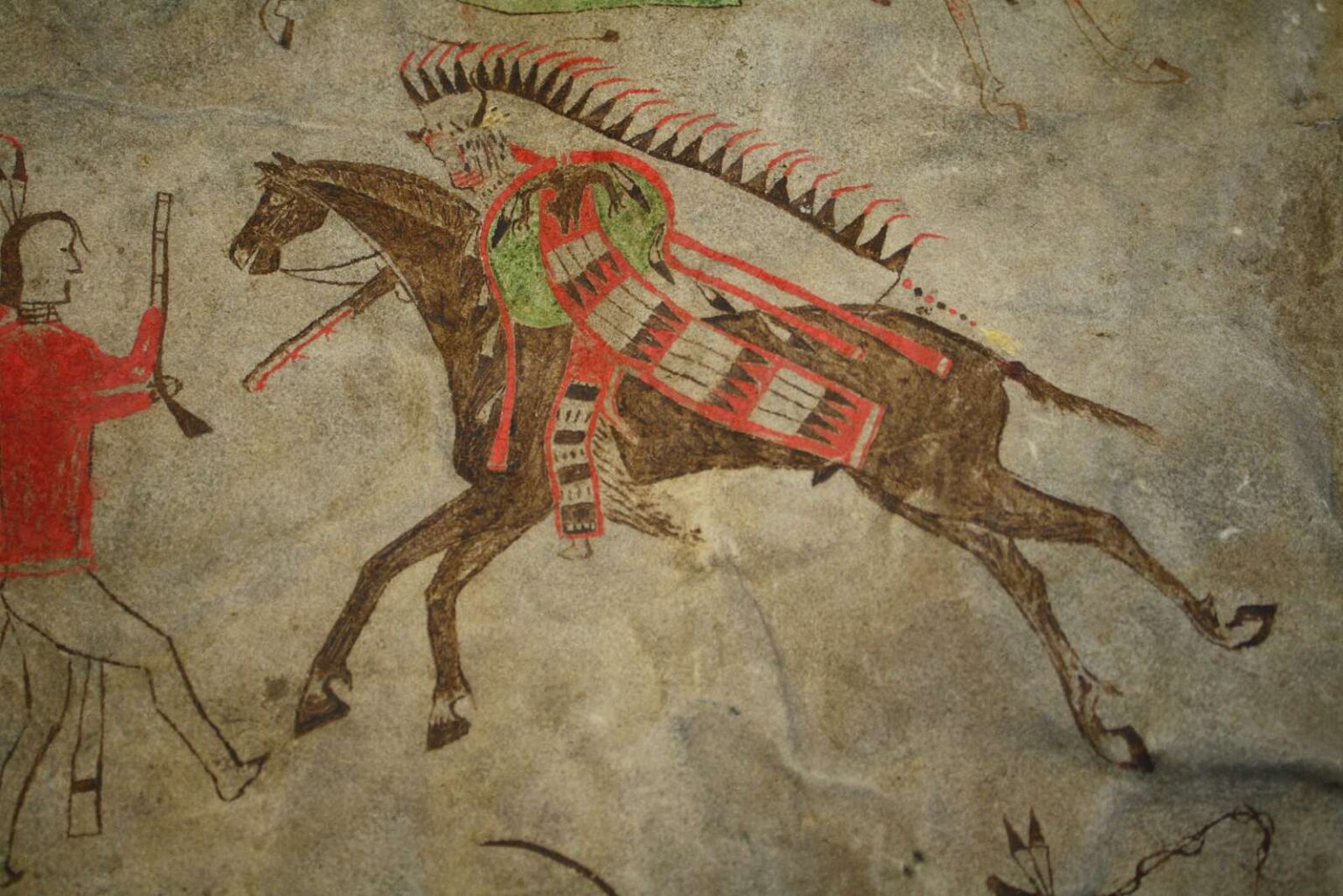 Výjev bitevní scény, tzv. piktogram z originálního bizoního pláště, který se nachází ve sbírkách Pennsylvánského muzea. Téměř jistě byly použity k jeho malbě kostěné štětce. Těmi je možné kreslit jak tenké čáry, tak i vybarvovat větší plochy.