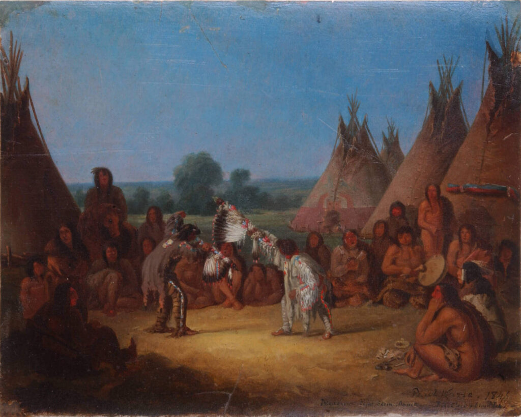 Obřadní tanec kmene Černonožců namaloval v roce 1848 malíř Paul Kane. Tanečníci drží v ruce troubele od posvátných medicinových dýmek.