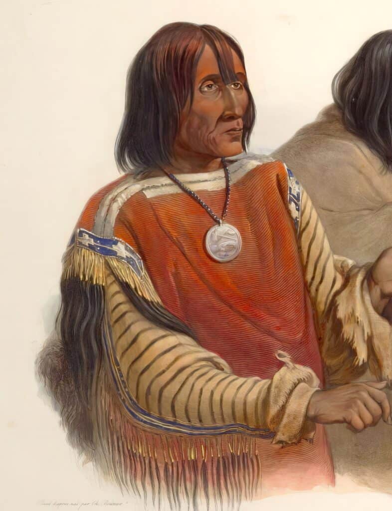 Náčelník Černonožců Krvavců. Kresba Karl Bodmer. Košile má tělo z červené vlněné látky s bílým okrajem.